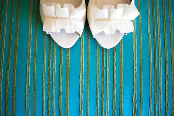 wedding shoes on aqua fabric background - photo by Florida based destination wedding photographer Chip Litherland of Eleven Weddings